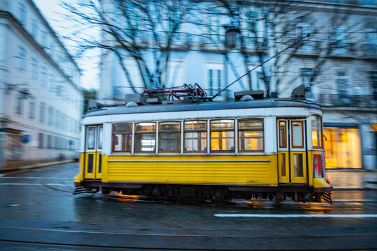 Tram speeding in downtown Lisbon / Portugal