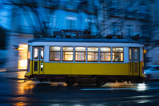 Tram speeding in downtown Lisbon / Portugal