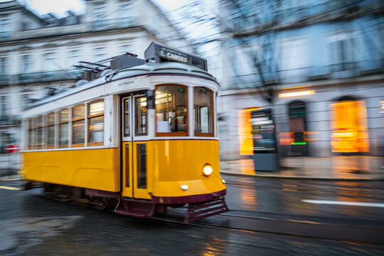 Tram speeding in downtown Lisbon / Portugal