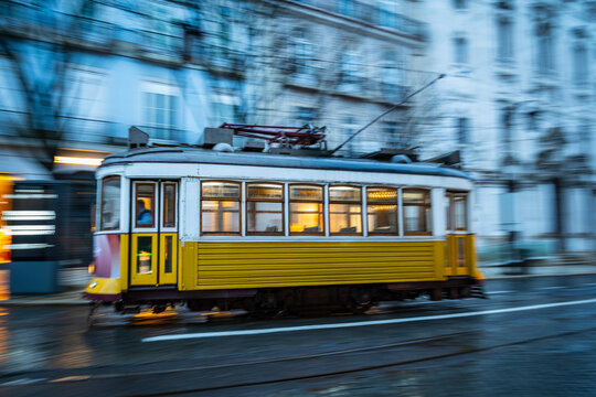 Tram speeding in downtown Lisbon / Portugal