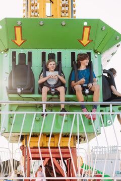 Kids smiling after thrilling drop ride moment