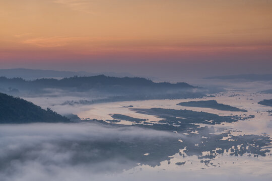 Sunrise with fog floating on the mountain and sky is a beautiful
