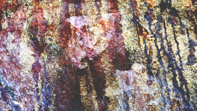 Rugged earthy texture with intense violet and ochre mineral veins