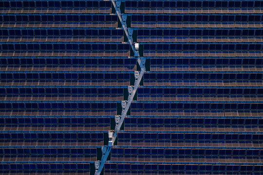 Aerial view of floating solar farm with rows of panels on the water in Bensheim, Hessen, Germany.