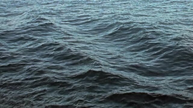 Witness mesmerizing dance of waves on vast Arctic Ocean. This captivating spectacle reflects profound beauty and raw power encountered during extreme expeditions through these frigid waters.