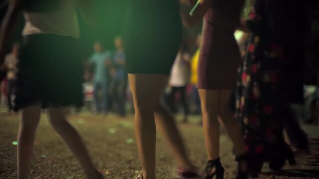 Drum leads halay dance at night wedding in Sivas Turkey with rhythm, crowd folk tradition. Percussion drives line dancers through village celebration, cultural music scene communal heritage.