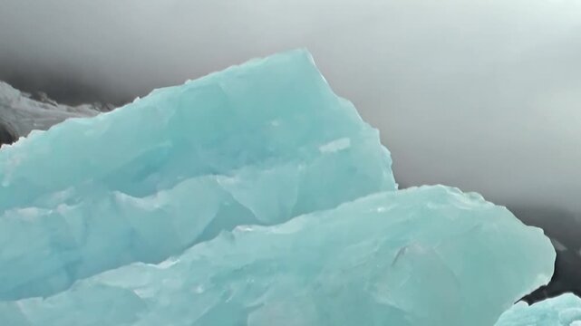 Exploring the remote Arctic Ocean unveils majestic blue icebergs, ancient titans silently drifting. This extreme polar adventure offers a glimpse into nature's frozen artistry.