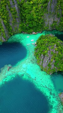 Cinematic aerial panorama of Coron islands &ndash; Iconic limestone cliffs, hidden emerald lagoons, and crystal clear turquoise water in Palawan, Philippines