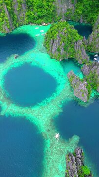 Cinematic aerial panorama of Coron islands &ndash; Iconic limestone cliffs, hidden emerald lagoons, and crystal clear turquoise water in Palawan, Philippines