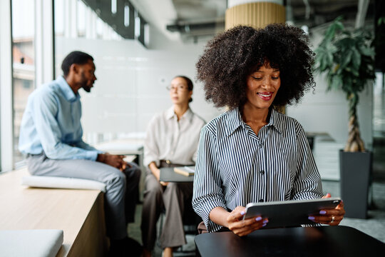 Portrait of a smart young businesswoman using a tablet computer in the office or classroom. Startup and succesful business concept or education and student concept