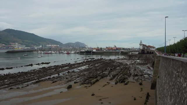 Flysch rock formations exposed at low tide in the port of Getxo