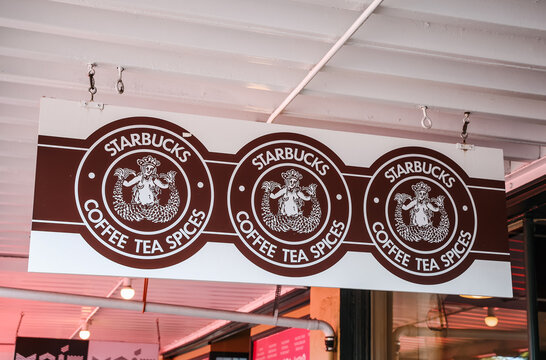 Seattle, WA, USA - july 4, 2025: The original Starbucks 1971 logo is seen on the storefront window at the Pike Place Starbucks store in Seattle, also known as the Original Starbucks.