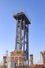 Blue Tower-Type Oil Extraction Equipment in Oil Field © Lijuan