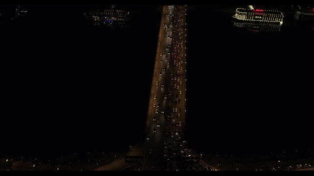 Qasr El Nil Bridge, Cairo, Egypt, Night Cityscape with Traffic and Nile River, Cinematic Orbit Drone Shot