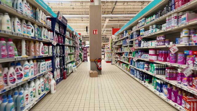 Supermarket Aisle with Laundry Detergent and Household Cleaning Products