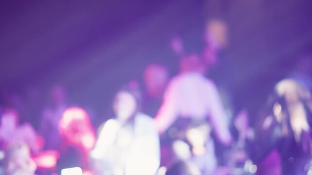 Musicians performing under colorful backlight. Stage show featuring silent performers and dynamic visuals
