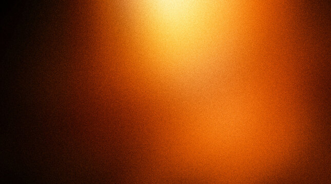 Abstract texture of a grainy orange surface with a bright light source in the upper center, creating a gradient effect