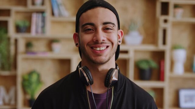Happy man, face or student with headphones for creative scholarship, knowledge or learning program. Portrait, male person and smile for future opportunity, development or growth in university college