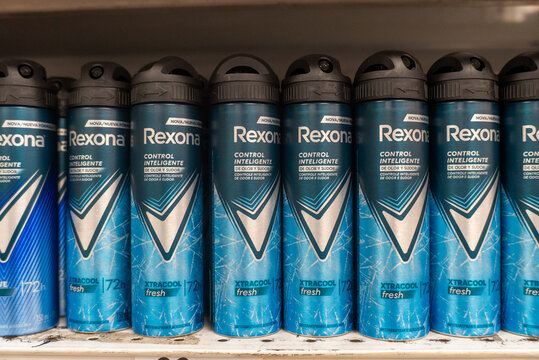 Villa de Alvarez, Colima. Mexico. April 14, 2026: Multiple Row of Blue Aerosol Deodorant Spray Cans with Black Caps Labeled "Rexona Xtracool Fresh"