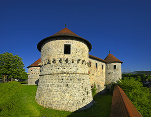 Obraz premium Zuzemberk Castle is one of the most picturesque and typical medieval fortresses in Slovenia. Its remains stand majestically on a steep cliff above the Krka river