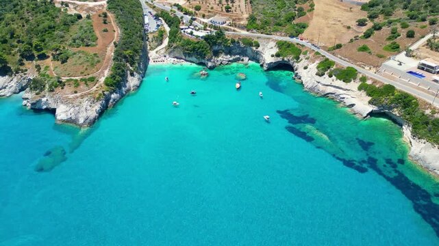 Spectacular drone view of Xigia Sulfur Beach in Zakynthos. Famous for its healing sulfur springs, crystal turquoise water, and steep limestone cliffs in a scenic Greek island bay.