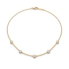 Fototapeta premium Necklace featuring five small circular diamonds set in a delicate gold chain provides a subtle and elegant look for daily wear.