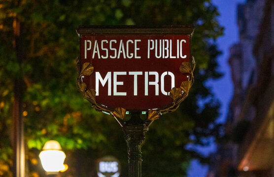 The entrance to the Paris Metro in the evening