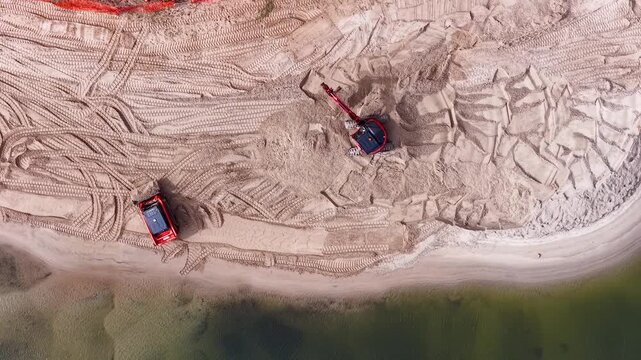 Aerial View of Excavator and Bulldozer Working on Gold Coast Beach