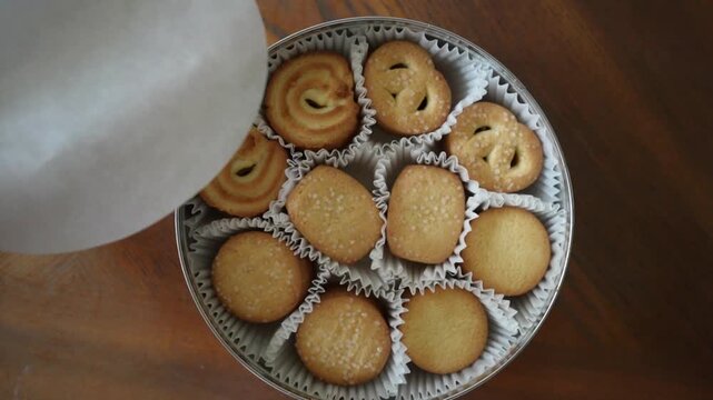 Set of tasty Danish butter cookies in a tin can. Top view of baked pastry, breakfast, sweet food, calories concepts.