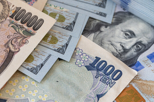 US dollars and Japanese yen banknotes exchange and finance concept