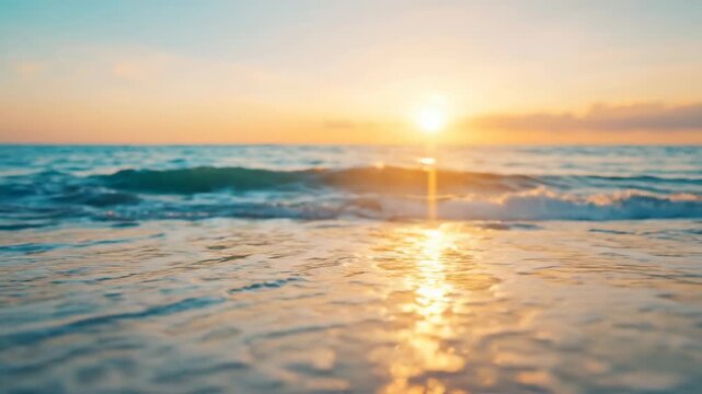 Slow motion tracking shot of ocean waves rolling and retreating on sandy beach at sunrise