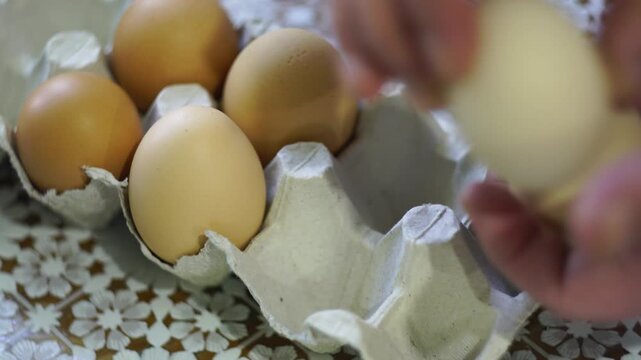 takes a few eggs from the package