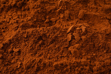 Fototapeta premium Cocoa powder as a background. Top view.