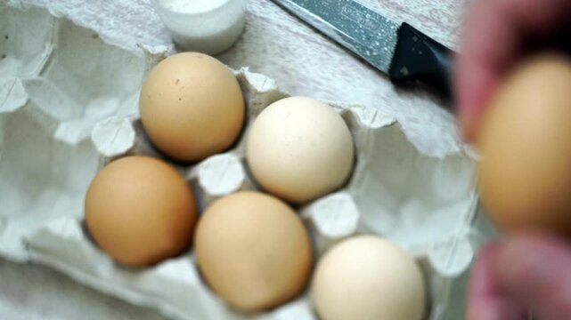 takes a few eggs from the package