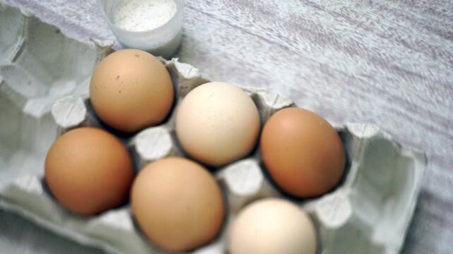 takes a few eggs from the package