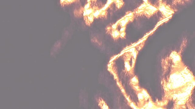 Dynamic abstract motion of golden light beams and organic fire-like shapes flowing across a dark grey surface