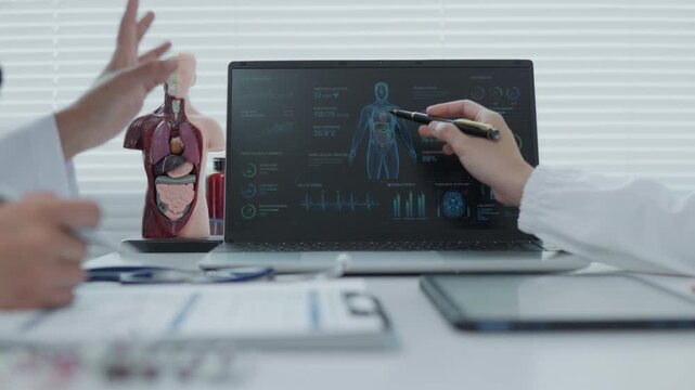 Medical Team Analyzing Anatomy scan X-Ray Data in Laboratory Setting with Advanced Technology and Detailed Models