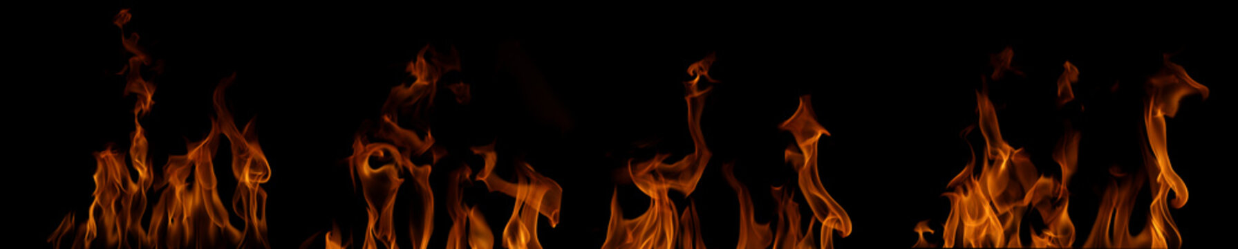 Realistic isolated fire flames on black background, glowing orange blaze element with transparent style, burning heat effect for overlay, design, composite and dramatic visuals.