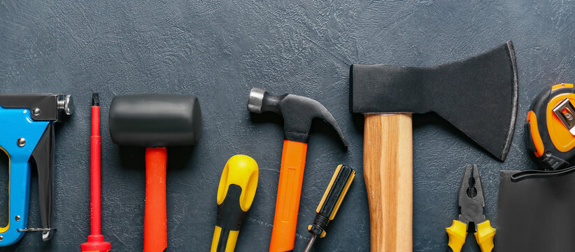 Set of construction tools on dark background
