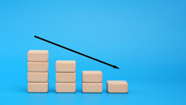 Wooden blocks with downward arrow for business decline concept