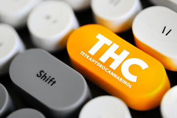 Naklejka premium THC - Tetrahydrocannabinol is the principal psychoactive constituent of cannabis, text concept button on keyboard