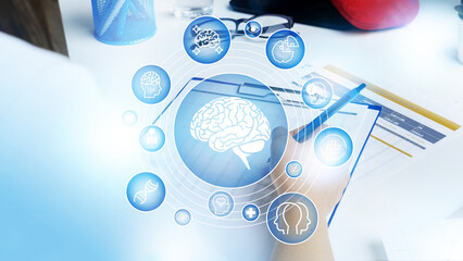 Fototapeta premium Person writing notes with brain icons during a research study on mental health effects