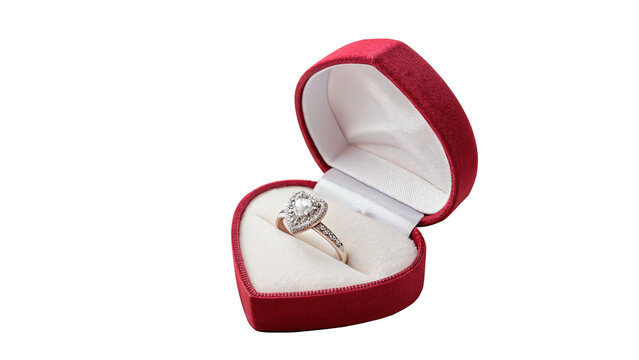 Small red velvet jewelry gift box opened to reveal a beautiful silver ring with diamonds isolated on transparent background