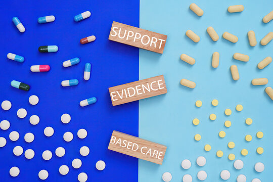 Evidence based care concept with pills and support text for healthcare medical wellness