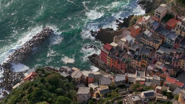 Fishing Village of Riomaggiore at sunset, Aerial View in Cinque terra coast in Italy, Italian riviera in Liguria.