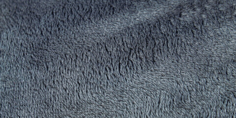 Soft and comfortable dark grey fleece fabric texture © Hendri