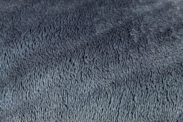 Soft and comfortable dark grey fleece fabric texture © Hendri