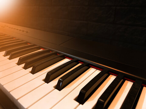close up of piano keys with the night lights in the pub