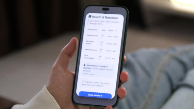 Monitoring progress in wellness. A student reviews their high scores in a Nutrition class via smartphone. Great for health education, lifestyle blogs, and remote learning advertisements. Authentic