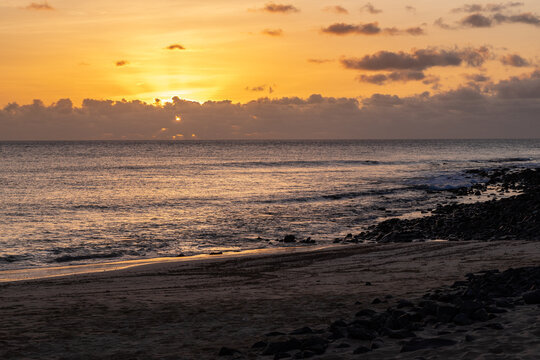 Amazing colorful sunset over the Ponta Preta beach (Black tip beach) on the southern part of the beautiful island of Sal in Cape Verde. The popular beach is isolated and deserted but gives amazing vie